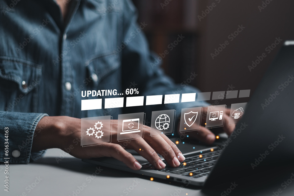 Businessman working and installing update process. Software updates or operating system upgrades to keep your device up to date with enhanced functionality in new versions and improved security.